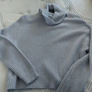 light blue knitted turtle neck sweater